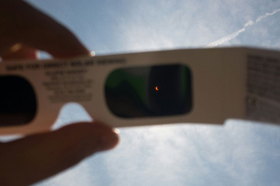 an image of the sun through the lens of eclipse glasses